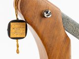 a close up of a knife with a tag attached to it