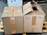two boxes sitting on a pallet next to each other