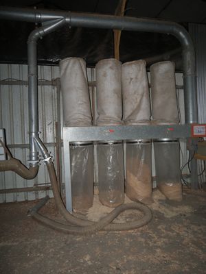 a bunch of bags that are sitting on a rack