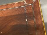 a close up of a piece of wood with peeling paint on it