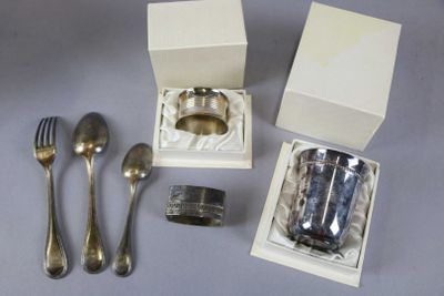 a silverware set in a white box with a silver spoon and fork