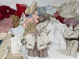 a pile of clothes and clothes that are on a table