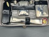 an open suitcase with tools in it on a table