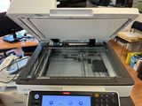 a printer that is sitting on top of a desk