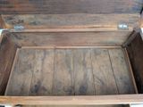 a wooden box that is open on top of a table
