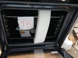 a sign on the door of an oven that is not open