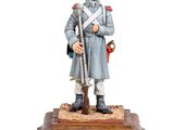 figurine of a soldier with a rifle on a wooden base