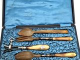 a case with a set of wooden utensils in it