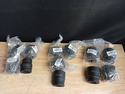 several different types of camera lenses sitting on top of a wooden table