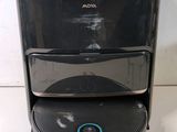 a picture of a black and silver speaker on top of a table