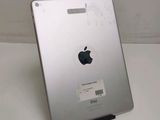 an apple ipad with a sticker on it sitting on a table