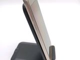 a close up of a cell phone on a cell phone stand