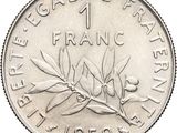 a close up of a one franc coin on a white background