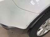 a close up of a white car with a black rim