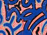 graffiti on a wall with a blue background and a pink and blue design