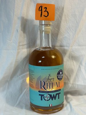 a bottle of liquor sitting on a table with a price tag on it