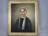 portrait of a woman in a black dress with a white headdress