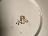 a close up of a plate with a crest on it