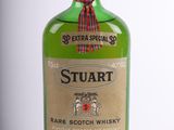 an image of a bottle of stuart rare scotch whisky on a white background