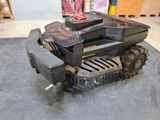 a small robot that is sitting on the floor