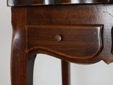 a small wooden table with a drawer on top of it
