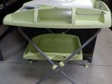 a baby changing table with a tray on top of it