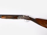 a shotgun with a wooden handle on a white background