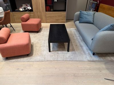 a living room with couches, chairs and a coffee table