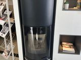 a black stove in the corner of a room