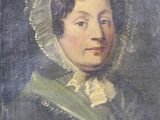 portrait of a woman in a green dress with a white bonnet