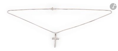 a necklace with a cross on a chain on a white background
