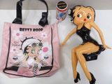 a plastic doll sitting next to a plastic bag