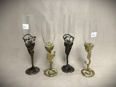 three wine glasses sitting next to each other on a table