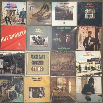 a lot of different album covers on a table