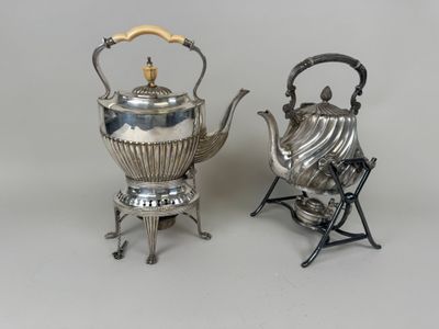two silver tea kettles and a folding chair on a white background