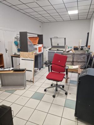 a red chair in the middle of a room