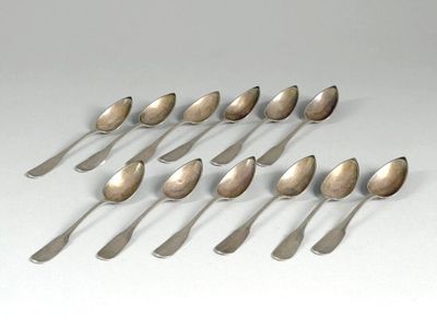 six silver spoons are arranged in a row on a white surface