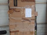 boxes stacked on top of each other in front of a garage door