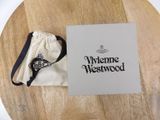 an image of a white box with a logo on it sitting on a wooden table