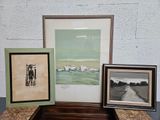three framed pictures sitting on a table next to each other
