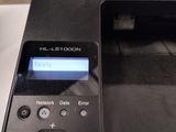 a black printer with a blue screen on it
