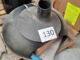 a large metal object sitting on a pallet next to a cardboard box