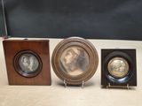 three framed pictures of a woman and a man in a wood frame