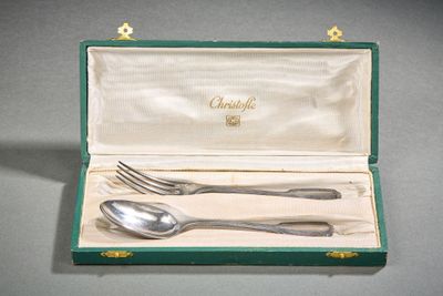 a silverware set in a green box with a spoon and fork