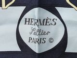 a black and white striped bag with a logo on it