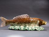 a figurine of a fish that is sitting on a table
