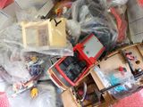 a pile of assorted toys and other items on the floor