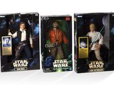 three star wars action figures are shown in a box