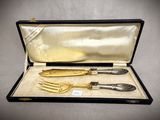 two forks and a knife in a case