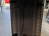 an image of a refrigerator in a kitchen with a heater in it